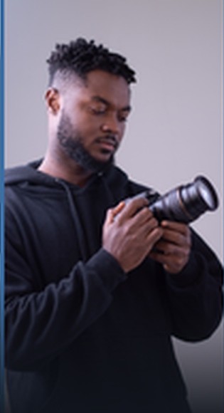 Photographer with camera in studio