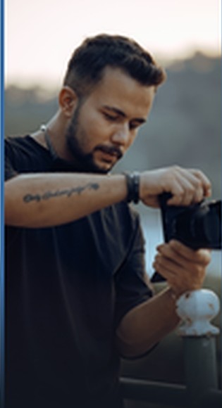 Photographer adjusting lens